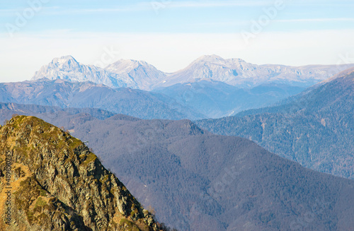 A magnificent mountain landscape with rocks against a clear blue sky. A tourist destination for lovers of hiking in the mountains