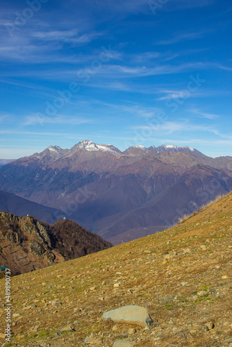 A magnificent mountain landscape with rocks against a clear blue sky. A tourist destination for lovers of hiking in the mountains