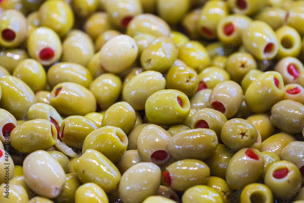 Sales of traditional products. Mediterranan olives in the market. Many bowls of olives at the farmer's market Sales of traditional products. Mediterranan olives in the market. Many bowls of olives at the farmer's market