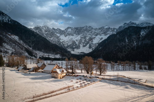 Aerial view over Zgornje Jezersko, Slovenia in winter with snow. Eco Tourist Farm. © 24K-Production