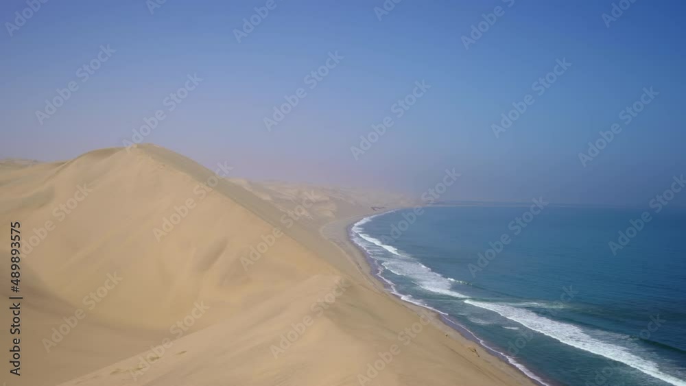 Sandwich Harbour in Namibia at the coast of the Atlantic Ocean. Sandy beach. Sandwich Harbour in Namibia at the coast of the Atlantic Ocean. Sandy beach.