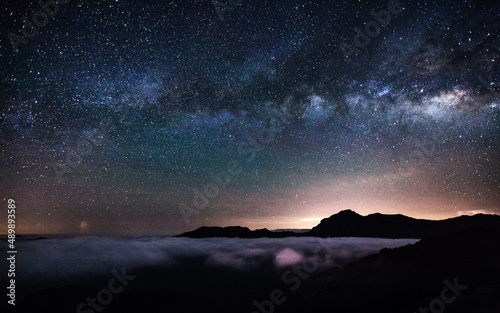 Colorful lighting reflect on the mountain with beautiful galaxy   Hehuan Mountain  Taiwan - the highest mountain in Taiwan Starry Night with Galaxy at Hehuan Mountain