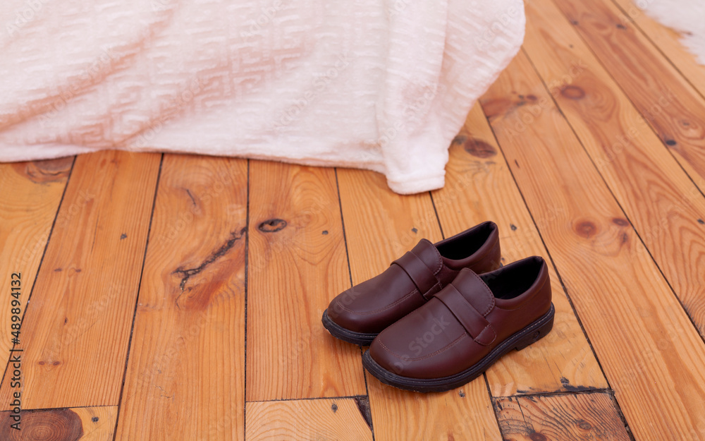 women's classic shoes stand on a wooden floor women's classic shoes stand on a wooden floor