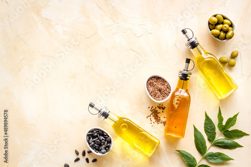 Different kind of cooking oil - sunflower olive and sesame oil with seeds photo
