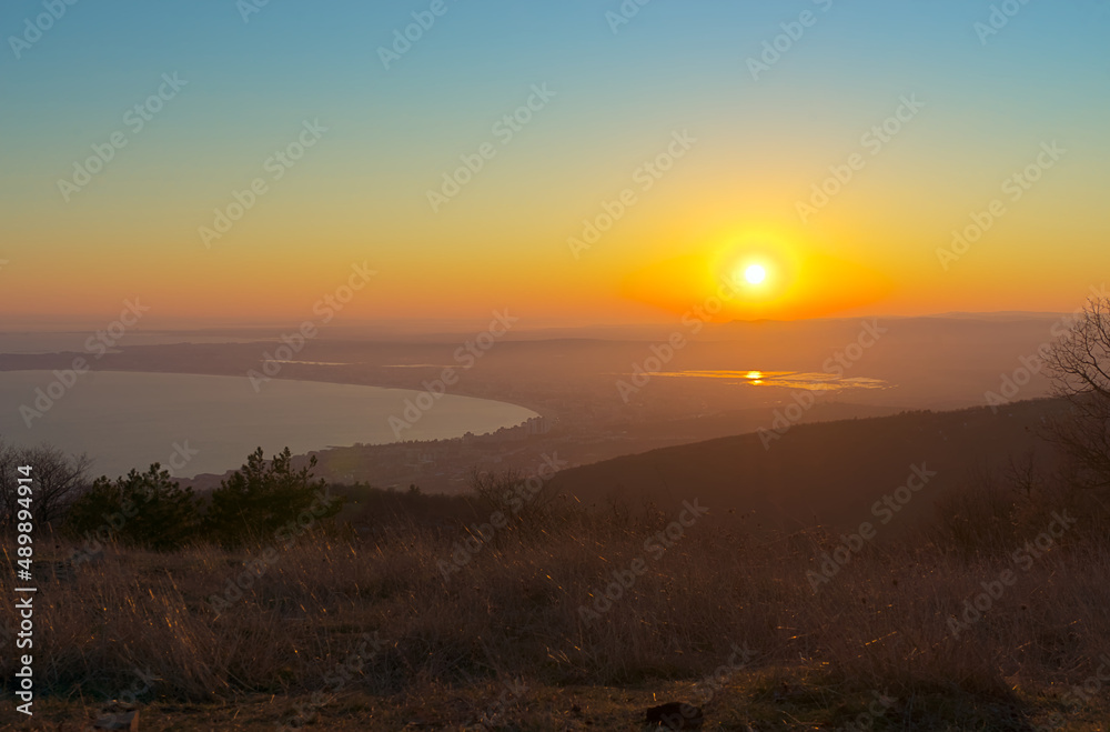 Overlooking a beautiful landscape at sunset, the sea and the valley