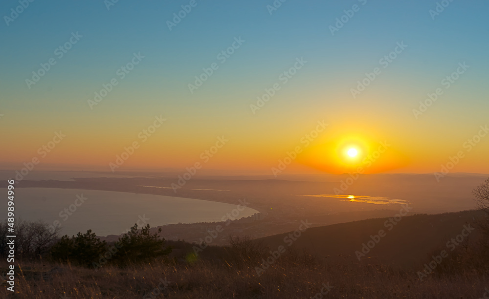 Overlooking a beautiful landscape at sunset, the sea and the valley