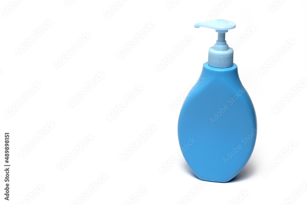 Closeup blue dispenser cream soap white background Closeup blue dispenser cream soap white background