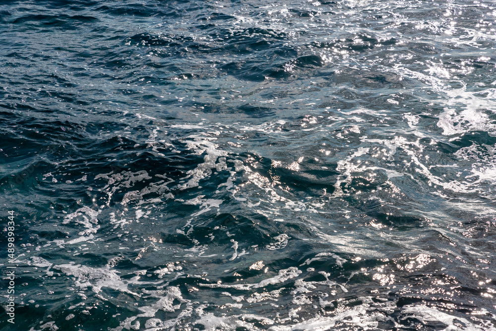 Blue water surface with small waves at sea Blue water surface with small waves at sea