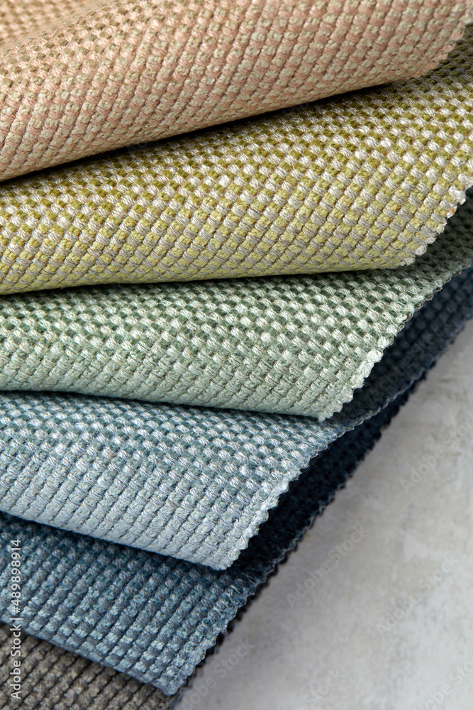 A set of samples of fabric furniture decoration lines of textile textures. Multicolored stripes upholstery. Mode and tone for a luxurious interior style. Abstract background. A set of samples of fabric furniture decoration lines of textile textures. Multicolored stripes upholstery. Mode and tone for a luxurious interior style. Abstract background.