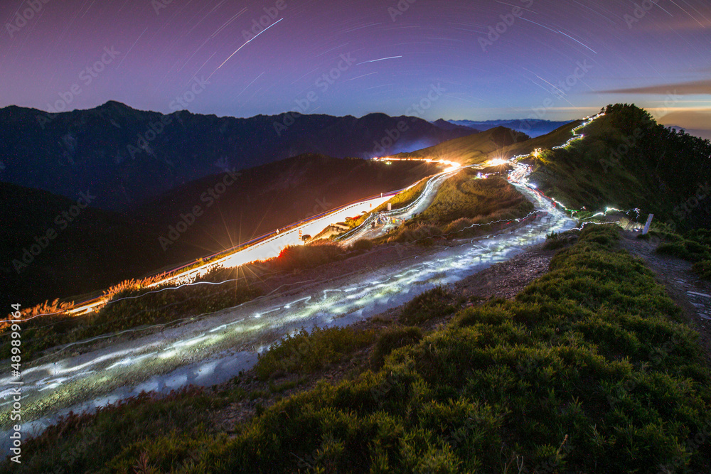 Colorful lighting reflect on the mountain with beautiful galaxy , Hehuan Mountain, Taiwan - the highest mountain in Taiwan Starry Night with Galaxy at Hehuan Mountain