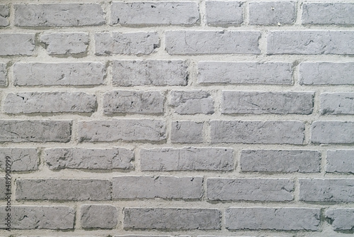 White brick wall texture background made by pattern paper. Wall texture background flooring rock stone old pattern clean concrete grid uneven bricks design stack. Background for the wall in LOFT style