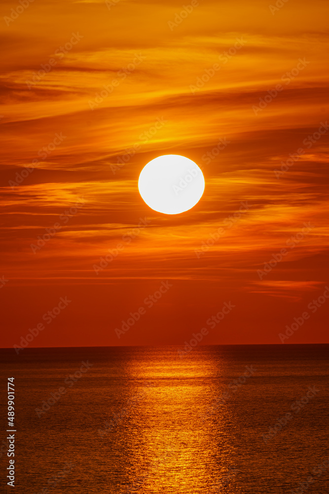Fantastic sunset over ocean. The sun goes down over the sea. Dramatic Sunset Sky Fantastic sunset over ocean. The sun goes down over the sea. Dramatic Sunset Sky