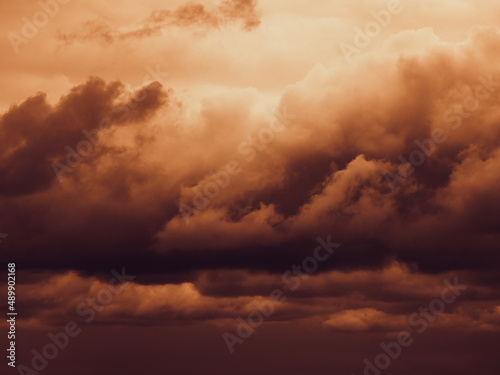 Storm sky with dark grey cumulus clouds. Thunderstorm