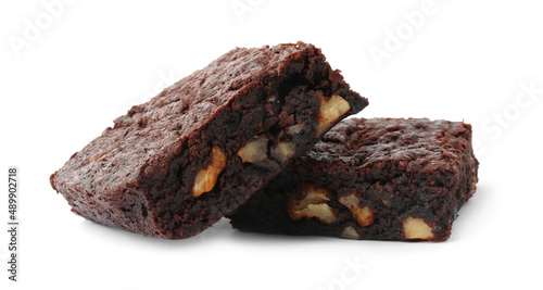Delicious brownies with nuts on white background