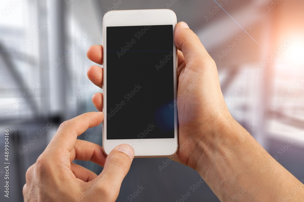 Man hands using smart phone with a blank screen