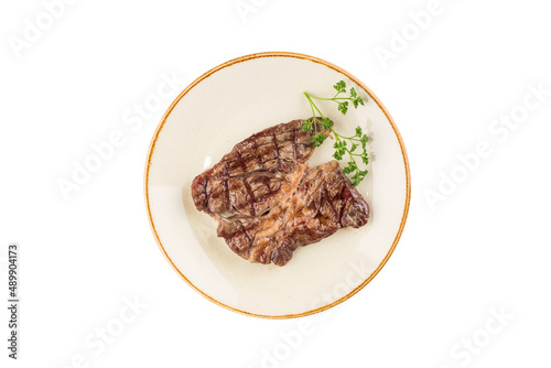 hot fresh grilled boneless rib eye steak on the plate isolated on white background