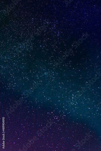 night starry sky over the forest, sky seen from Poland in February, colorful constellation of stars
