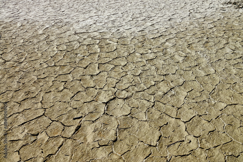 Climate change. Large mountain lake completely drained by drought. Ceresole Reale, Italy - February 2022 Climate change. Large mountain lake completely drained by drought. Ceresole Reale, Italy - February 2022