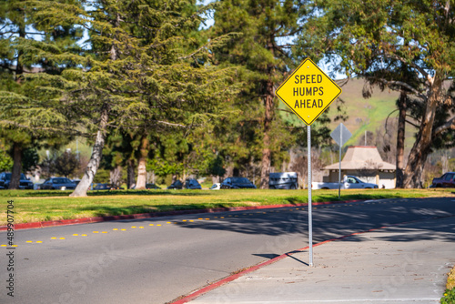 Photography Road sign Speed hump ahead at the entrance to the park.