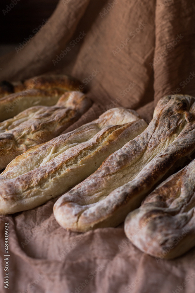 Homemade bread several pieces on a brown background. Home cooking concept. Bakery. Fresh, aromatic, hot bread Homemade bread several pieces on a brown background. Home cooking concept. Bakery. Fresh, aromatic, hot bread