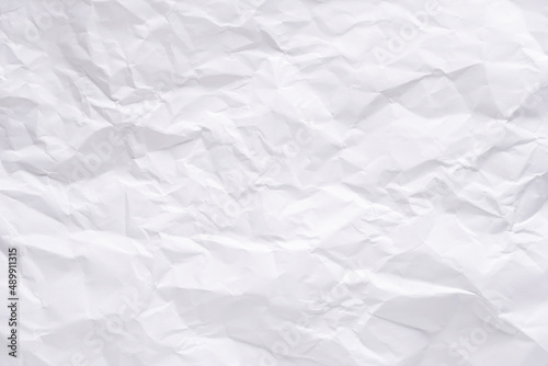 White crumpled paper texture background.