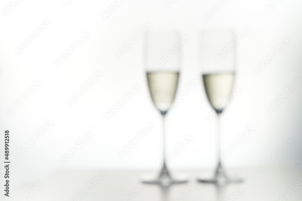 Blur of Two glasses of champagne. Isolated in white. Drunkenness concept. Blur of Two glasses of champagne. Isolated in white. Drunkenness concept.
