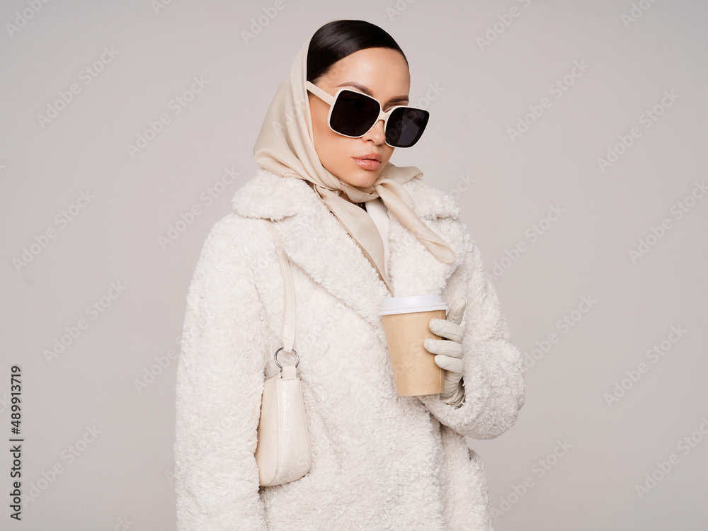 Beautiful young lady in a white faux fur coat Stock Photo | Adobe Stock