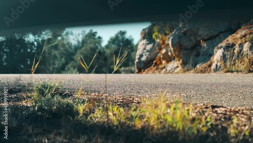 Longboard downhill rider fast road. Downhill road forest. Skateboard sport photo