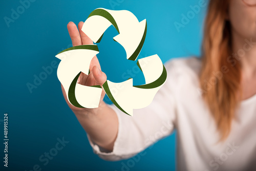 hand holding green recycle ...