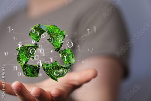 hand holding green recycle ...