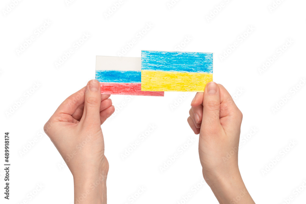 Stop war. Ukraine flag, Russia flag in woman hands isolated. Stop war. Ukraine flag, Russia flag in woman hands isolated.