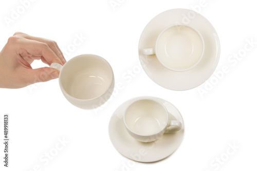 Empty coffee cup in woman hand isolated on white.