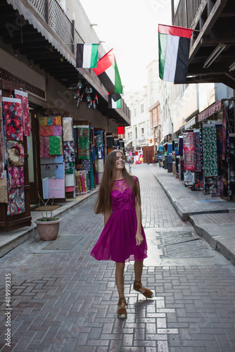 Girl tourist walks in the old Arab city. Vacation and sightseein