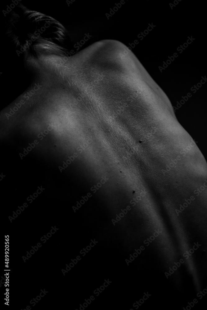 Black and white photo of body parts,yoga poses of a naked female body Black and white photo of body parts,yoga poses of a naked female body