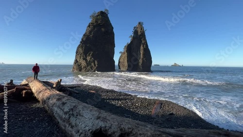 Male hiking on the rugged coastline of Olympic National Park photo