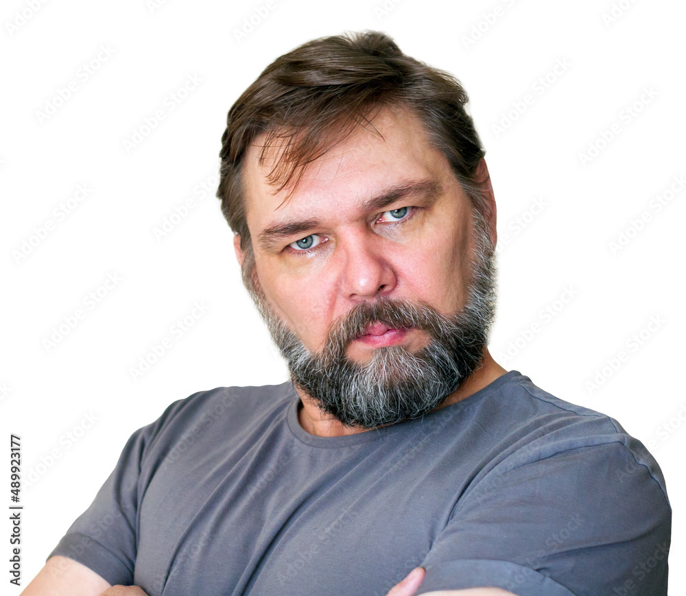 A middle-aged man with a gray beard is looking at us. Handsome man isolated on white background. A middle-aged man with a gray beard is looking at us. Handsome man isolated on white background.