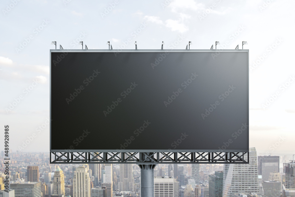 Blank black billboard on cityscape background, front view. Mock up, advertising concept Blank black billboard on cityscape background, front view. Mock up, advertising concept