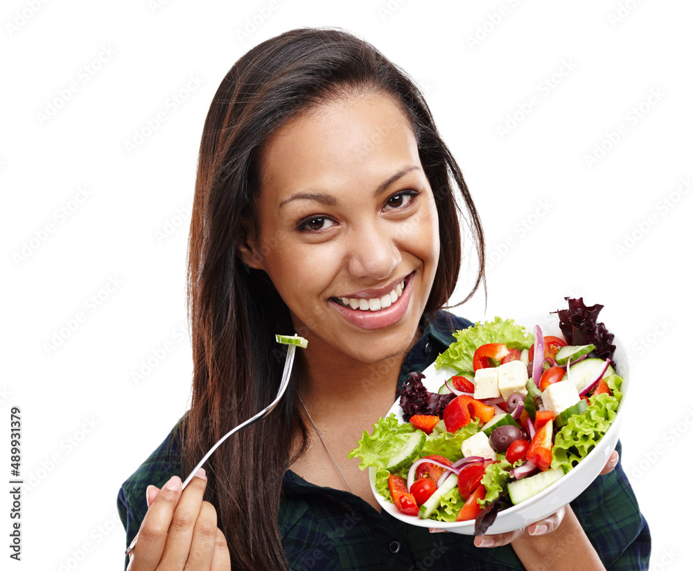 Making the healthy choice. Portrait of an attractive young woman enjoying a bowl of salad isolated on white. Making the healthy choice. Portrait of an attractive young woman enjoying a bowl of salad isolated on white.