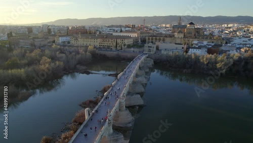 aerial view of the town of Cordoba in Andalusia, Spain, medieval cathedral and roman bridge over Guadalquivir river, UNESCO World Heritage site photo