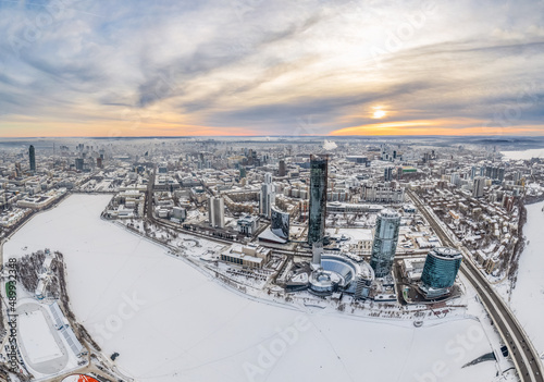 Yekaterinburg aerial panoramic view in Winter at sunset. Yekaterinburg city and pond in winter.