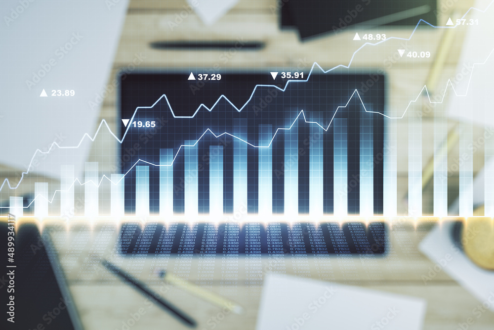 Abstract creative financial graph and modern digital tablet on background, top view, forex and investment concept. Multiexposure Abstract creative financial graph and modern digital tablet on background, top view, forex and investment concept. Multiexposure