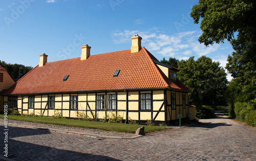 Colorful old historic country house in Denmark. Traditional Scandinavian houses.