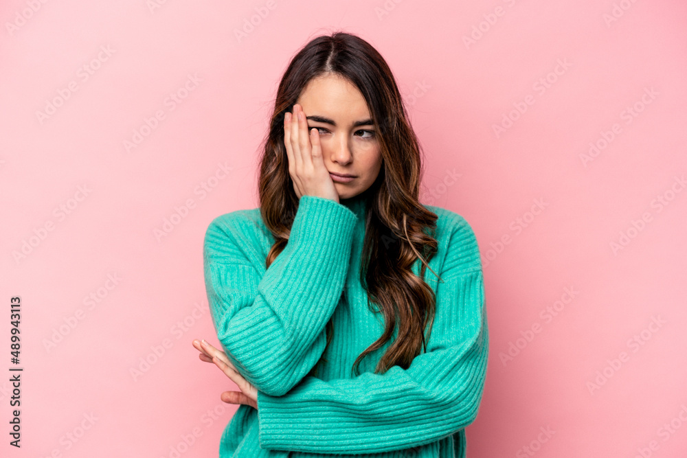 Young caucasian woman isolated on pink background who is bored, fatigued and need a relax day. Young caucasian woman isolated on pink background who is bored, fatigued and need a relax day.
