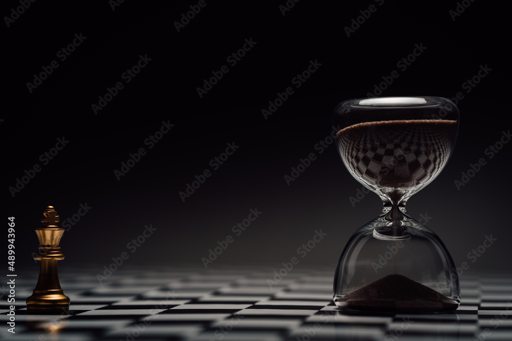 Chess figure looking at hour glass Chess figure looking at hour glass