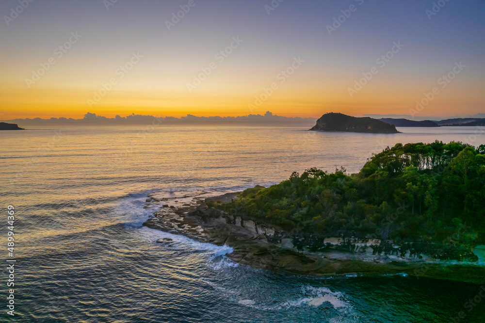 Aerial sunrise seascape with clear skies