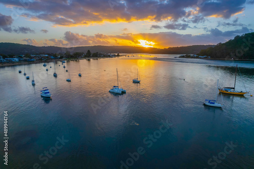 Aerial sunrise waterscape with boats