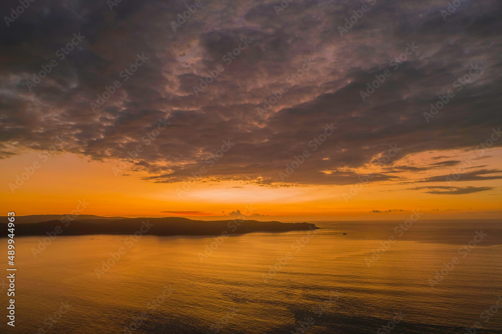 Aerial sunrise seascape with  low clouds