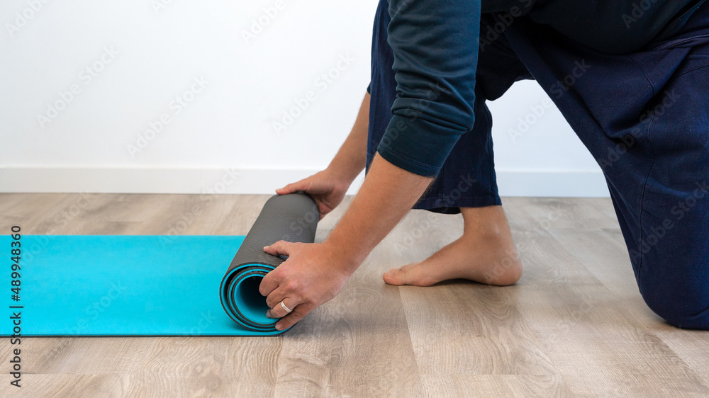 Elevate view male hands in sportswear doing healthy yoga in the house  indoor Stock Photo | Adobe Stock