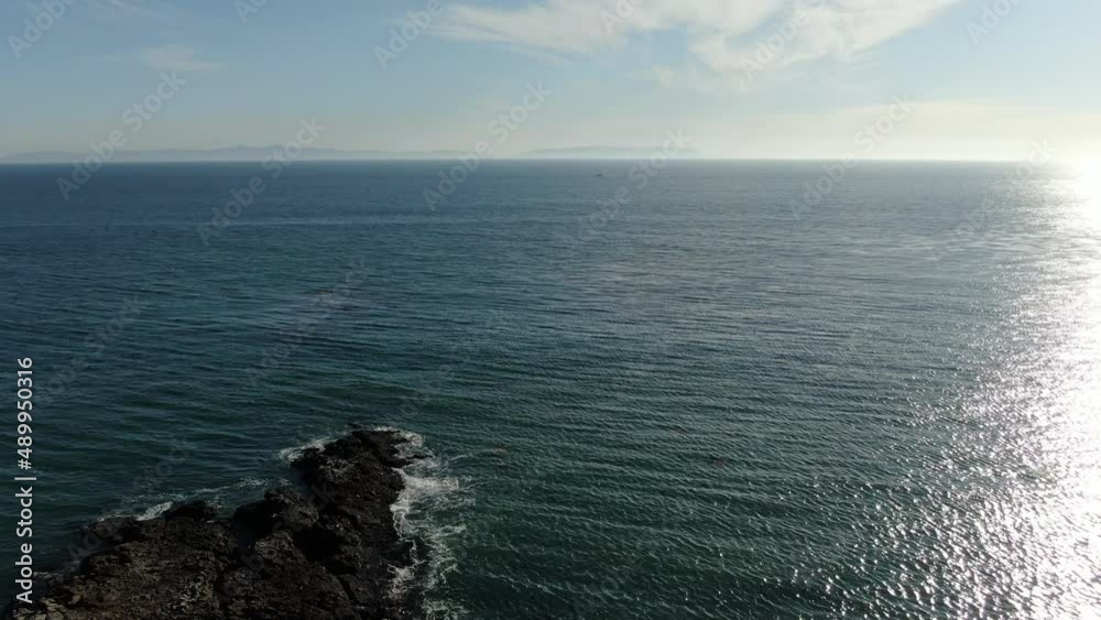 South Pacific Ocean Shore Aerial Shot Island in the Horizon South Pacific Ocean Shore Aerial Shot Island in the Horizon