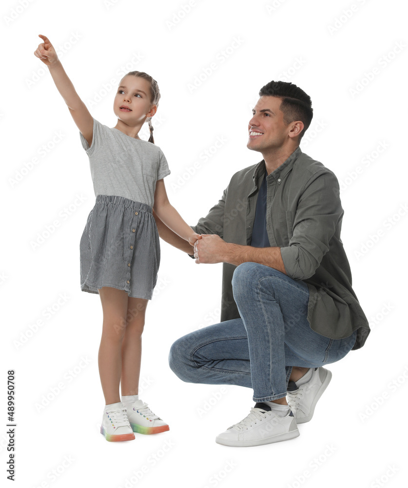 Fototapeta premium Little girl with her father on white background